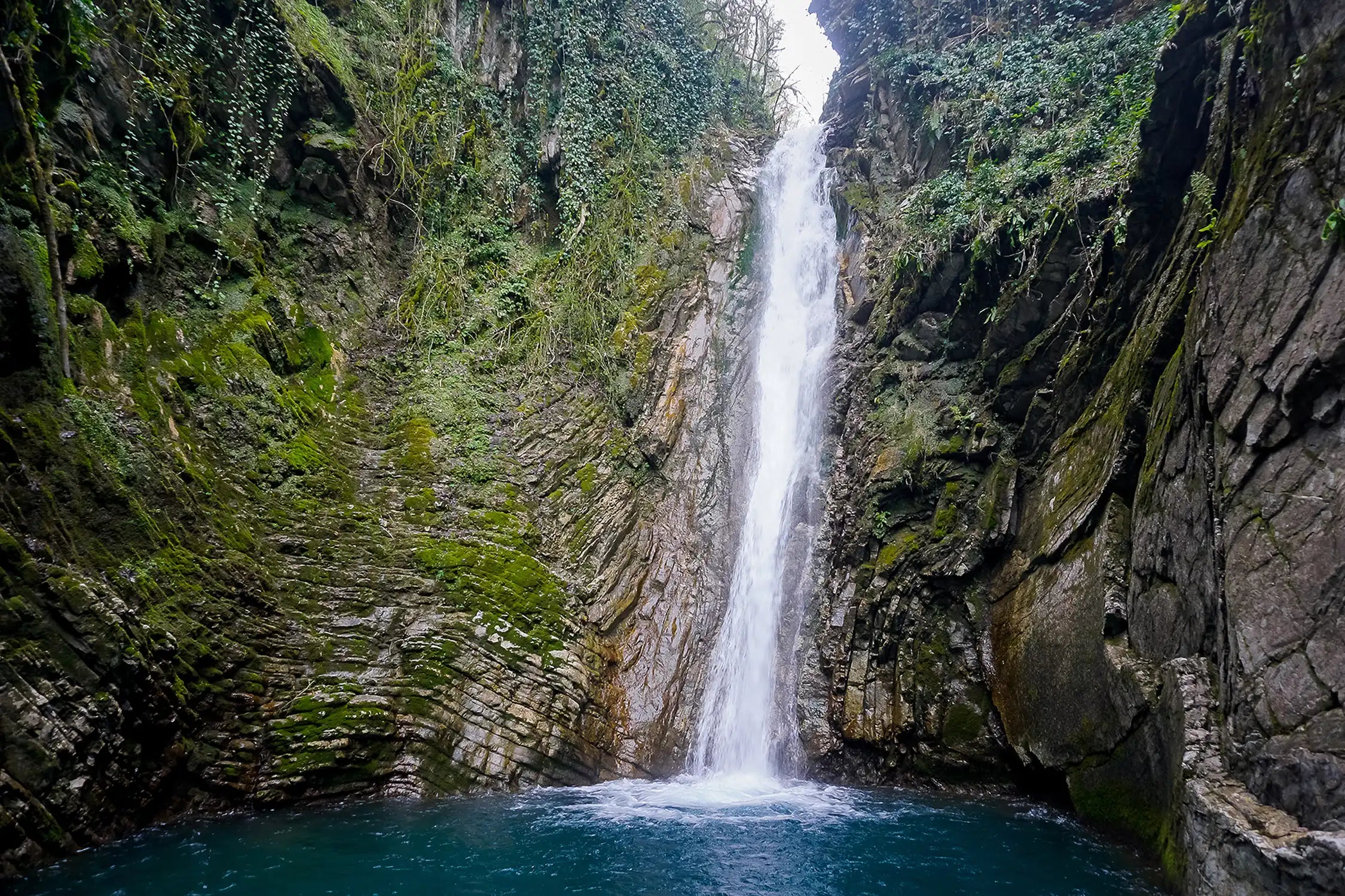 A picturesque waterfall in the jungle of the Krasnodar Territory