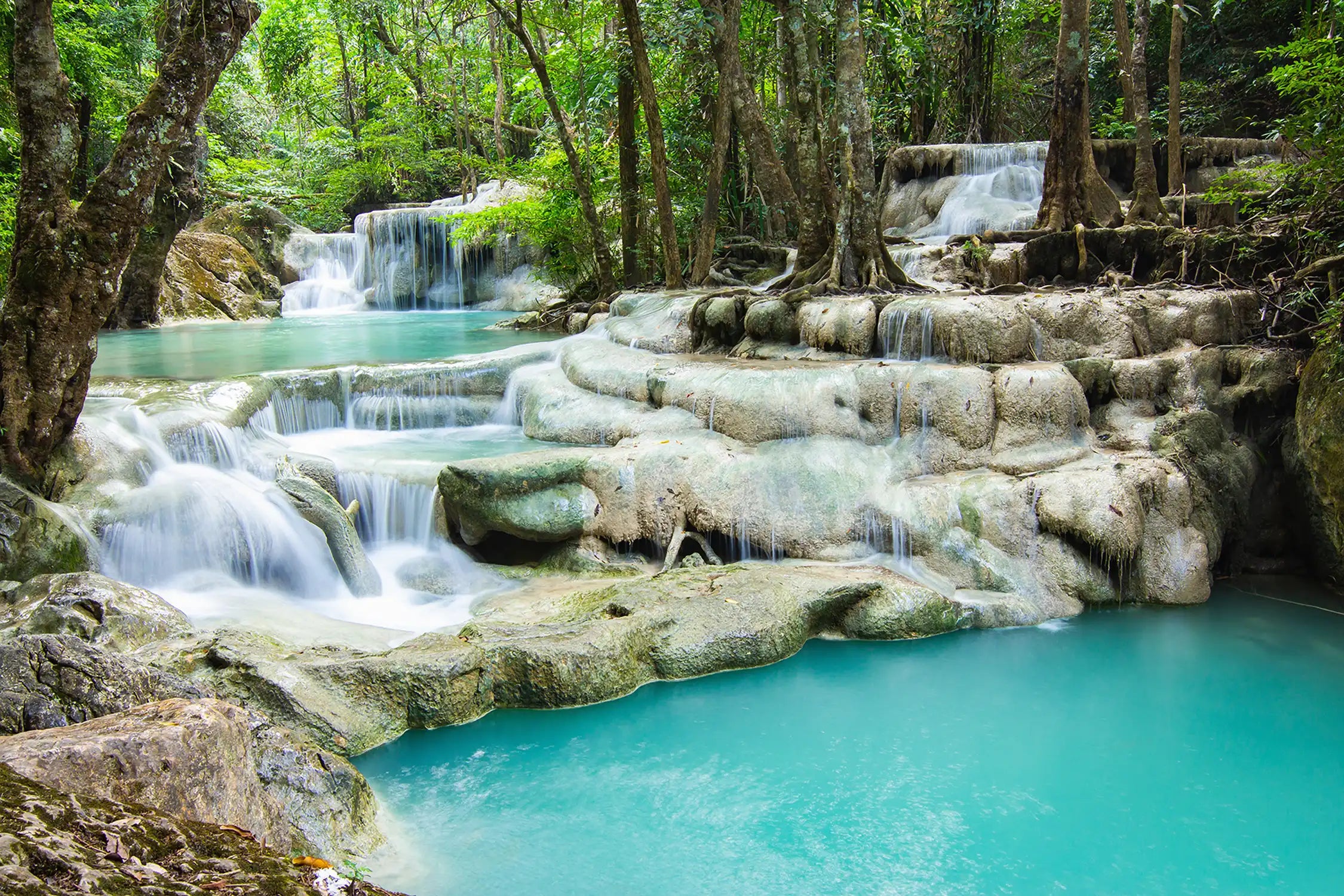 Erawan Falls (The fifth waterfall – Buer Mai Long) with emerald green ponds in Erawan National Park