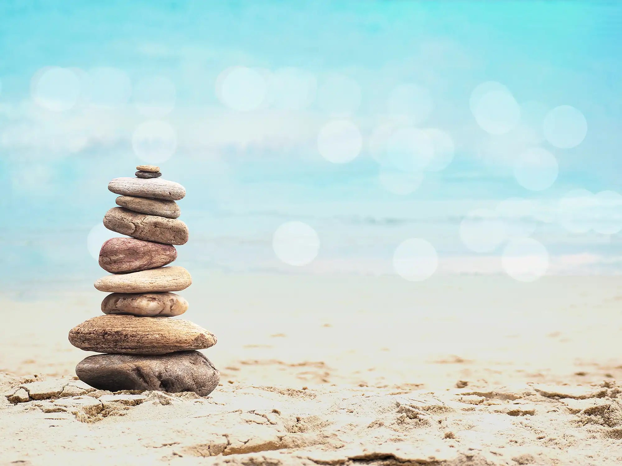 Pebble pyramid on summer beach